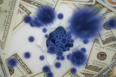 Un conjunto de pelotas que representan al covid19 irrumpen entre varios billetes de 100 dólares